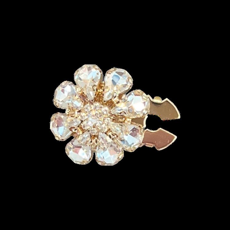 Stor blomst med blanke glass steiner