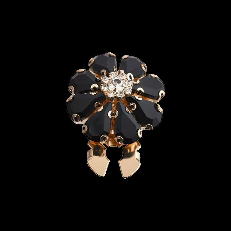 Stor blomst med sorte steiner